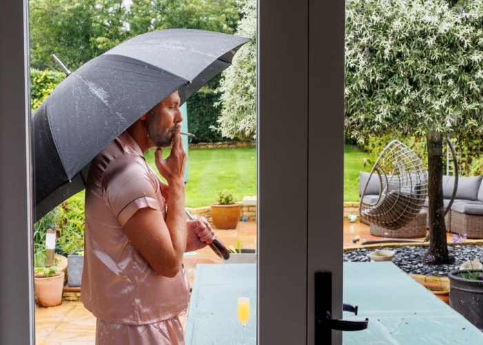 bride outside with her umbrella in the morning 